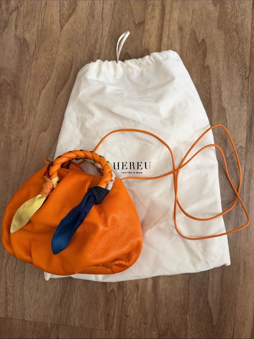 Hereu Orange Leather Mini Bag with Braided Handle and Scarf Accent